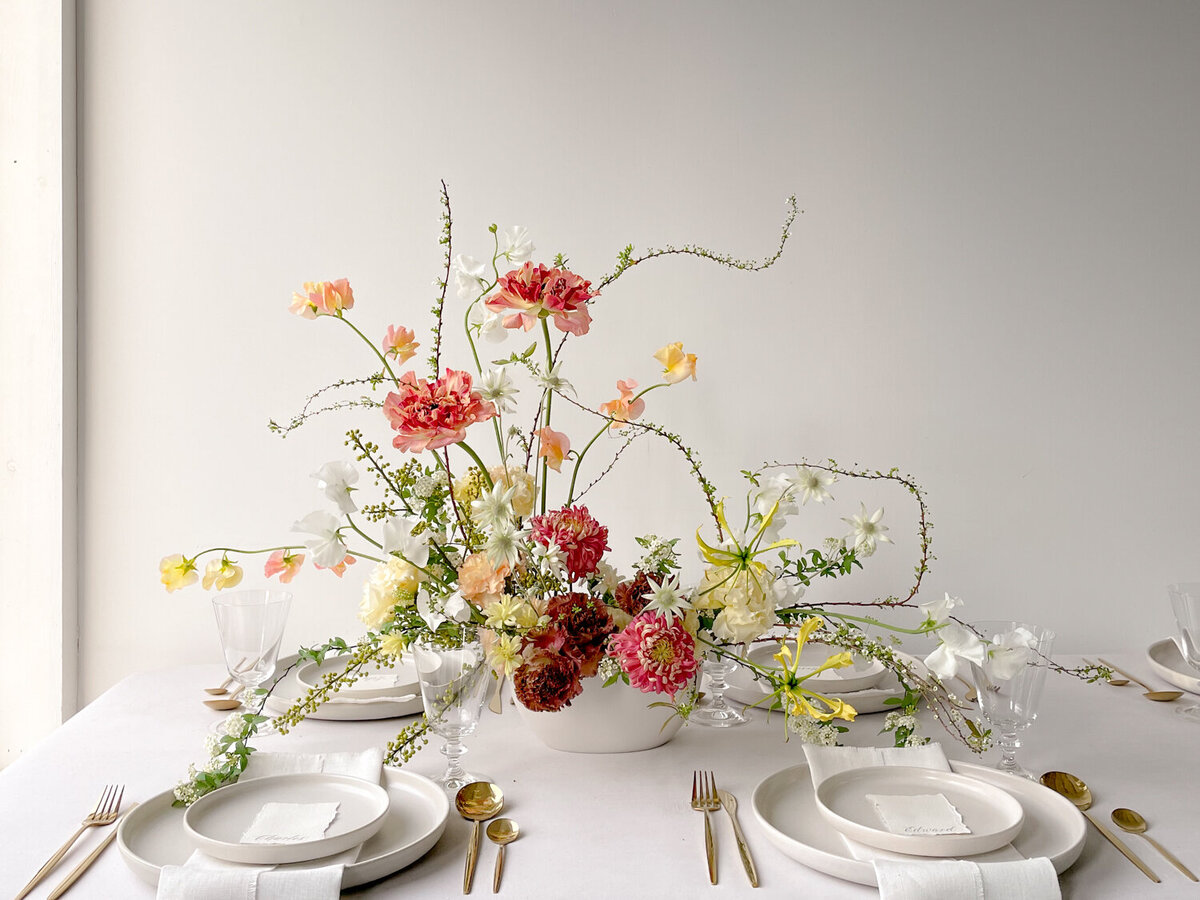 architectural-springtime-wedding-centrepiece-peach-ranunculus