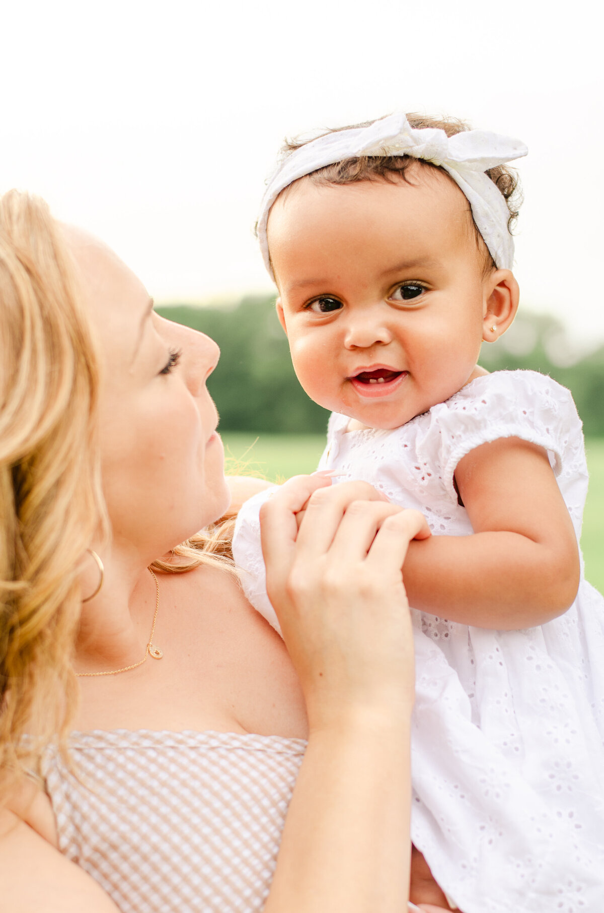 mom holds nine month old baby close