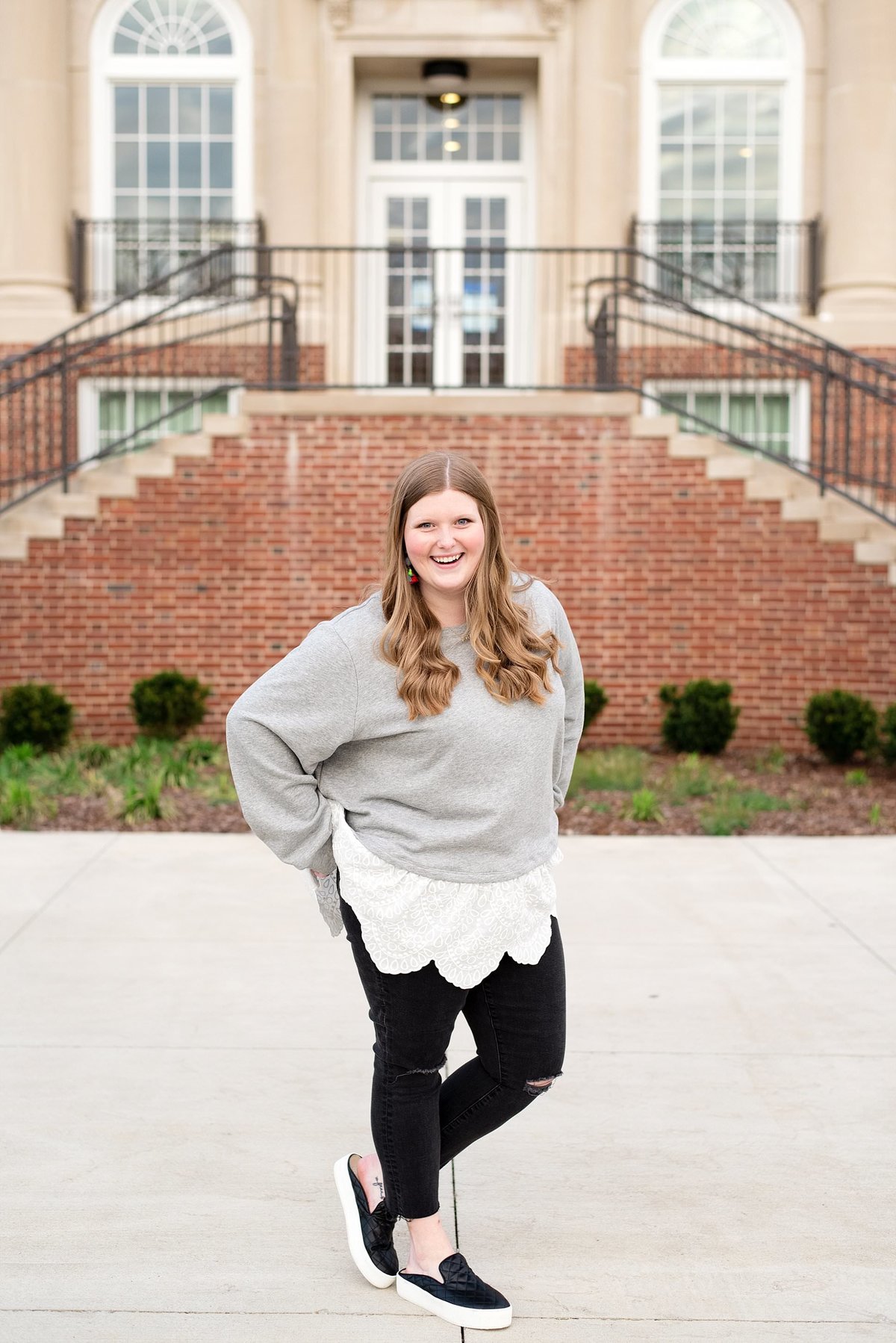 Chi Omega Sorority senior photoshoot on the Middle Tennessee State University campus wearing black leggings and relaxed grey and white lace top