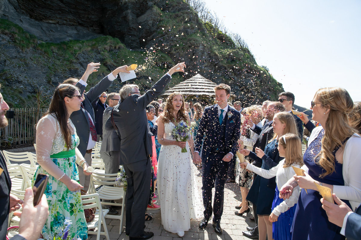 Confetti on newly married couple Tunnels Beaches wedding venue in Devon