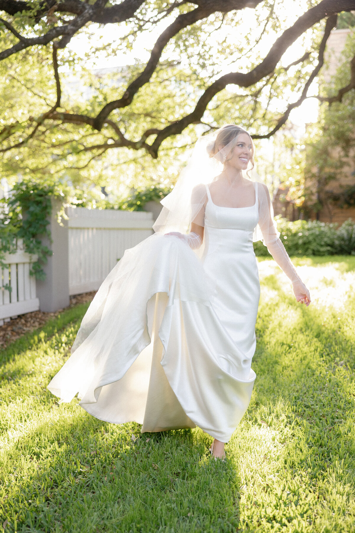 bride in Ines di Santo wedding dress walking in grass