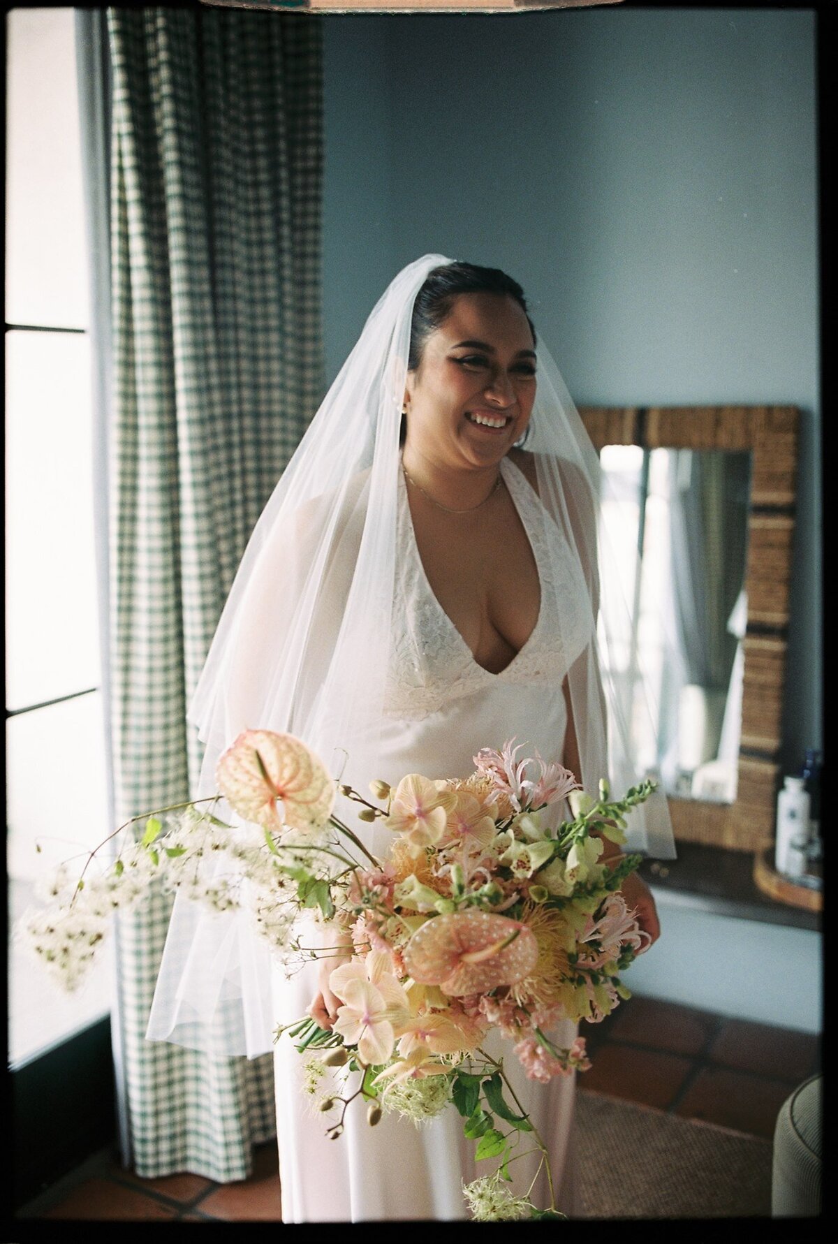 Bride getting ready before santa barbara courthouse wedding on film
