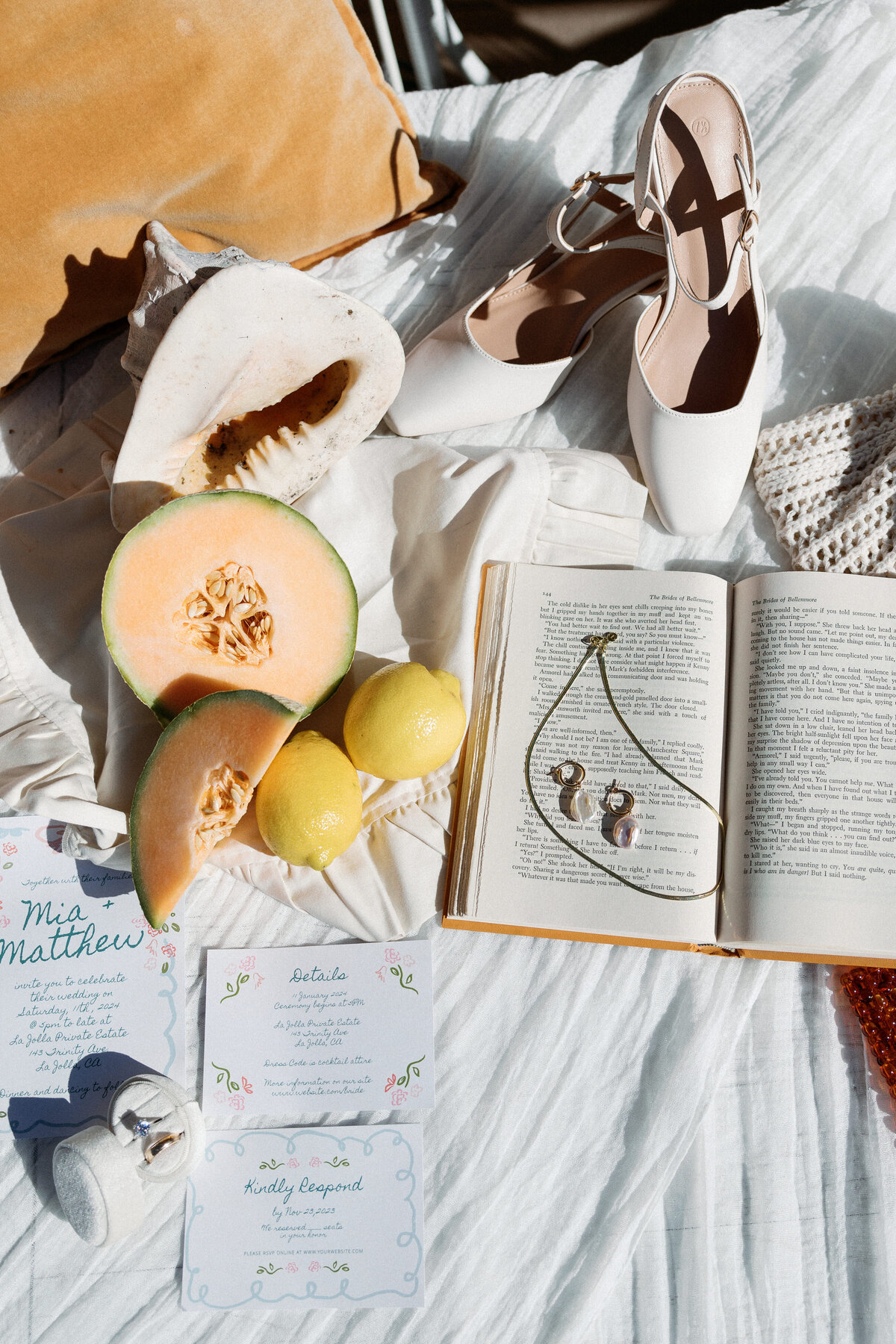 Close-up of wedding invitations and floral details on a beautifully set table, reflecting the couple's style in La Jolla California.