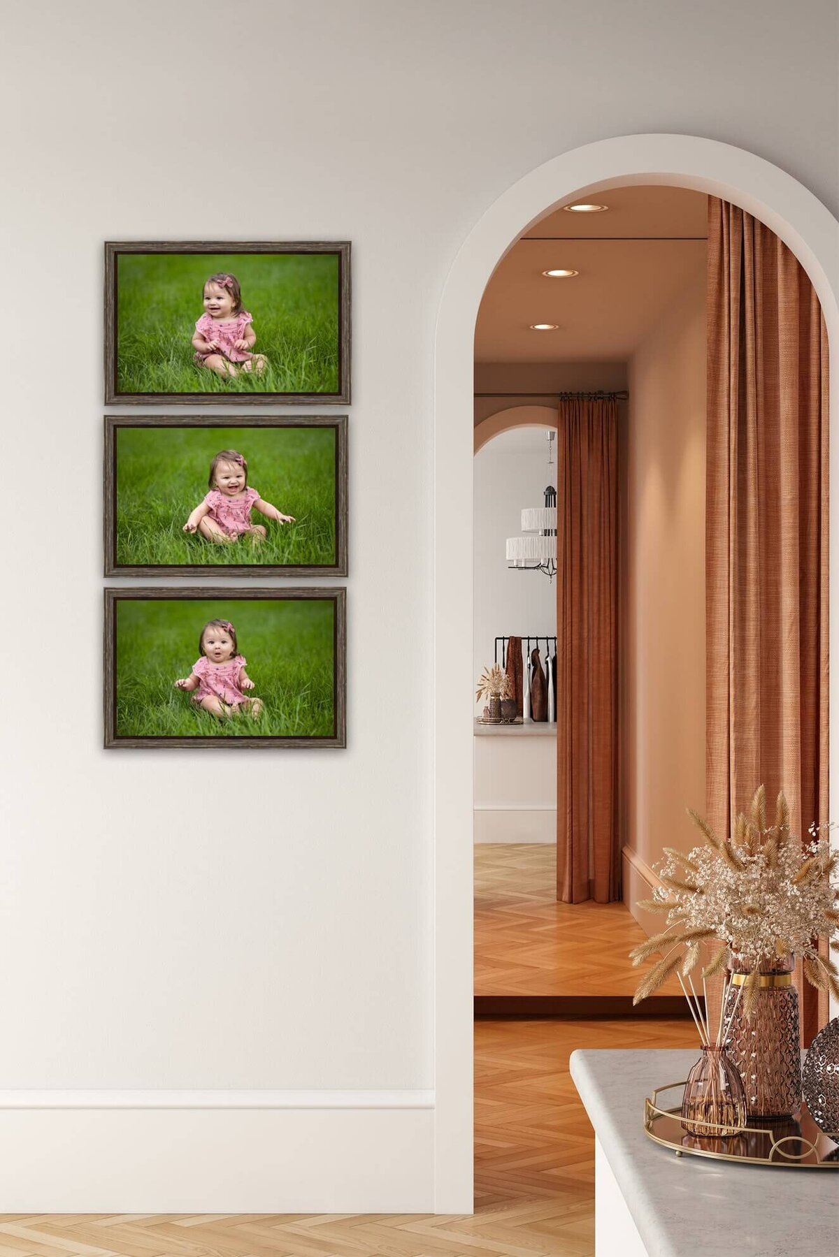 three canvas pictures of a little girl hanging on a wall next to a doorway in a home