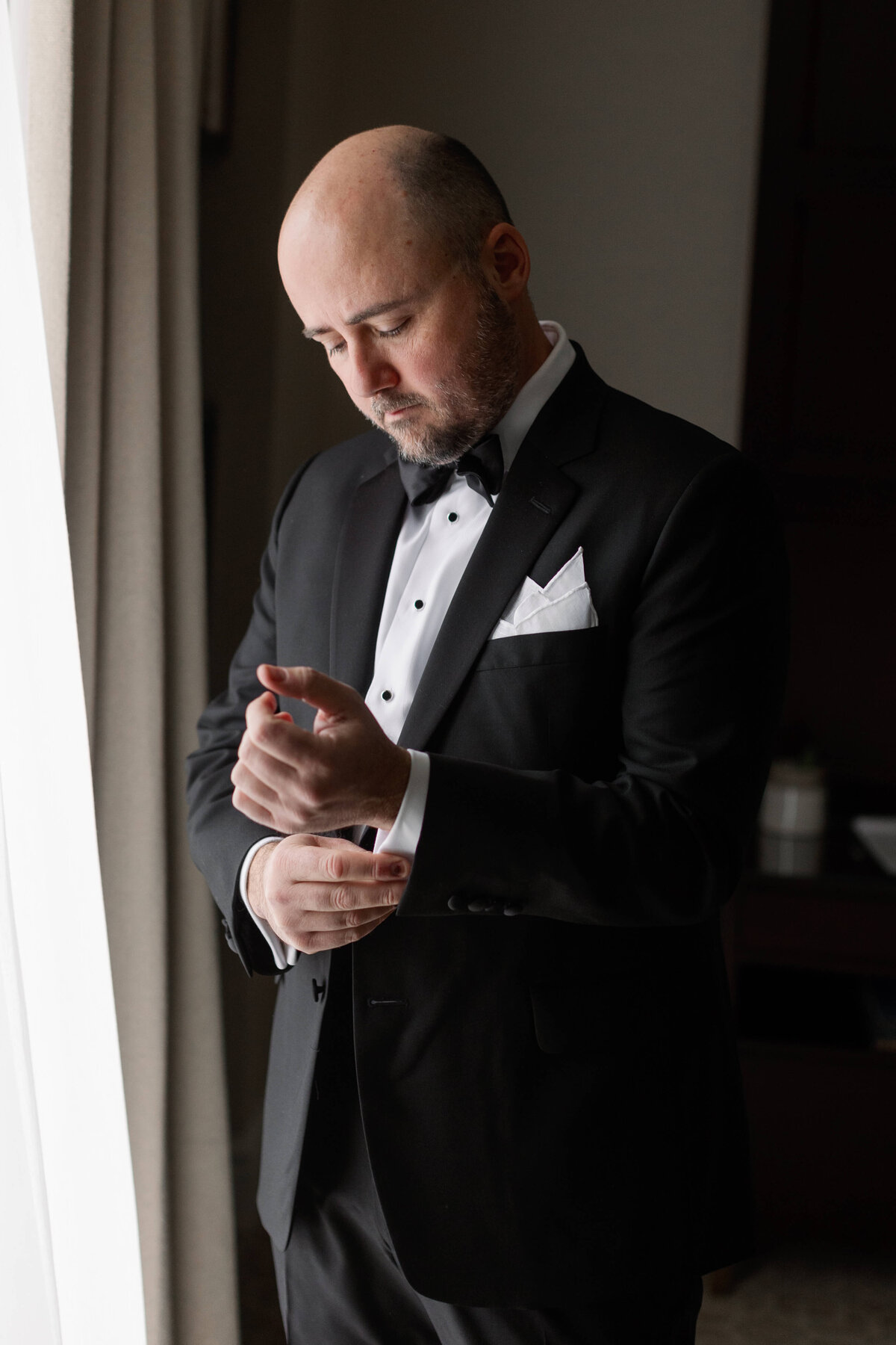 Groom getting ready at at Rosewood Mansion on Turtle Creek
