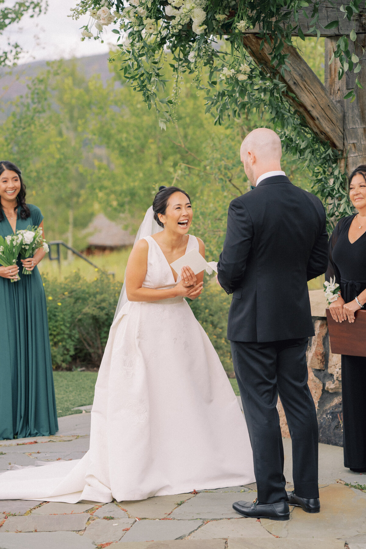 Laughs during the ceremony at Colorado wedding