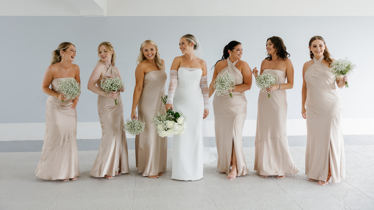 Bride with her bridesmaids in Miami, captured by Claudia Amalia, a wedding and lifestyle photographer based in Miami and Florida Keys South Florida. Specializing in destination weddings.