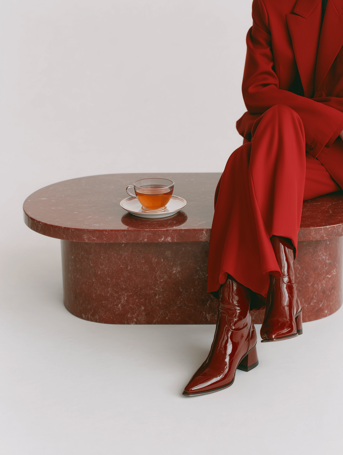 Pam sitting at her desk in front of a window writing out a podcast strategy plan