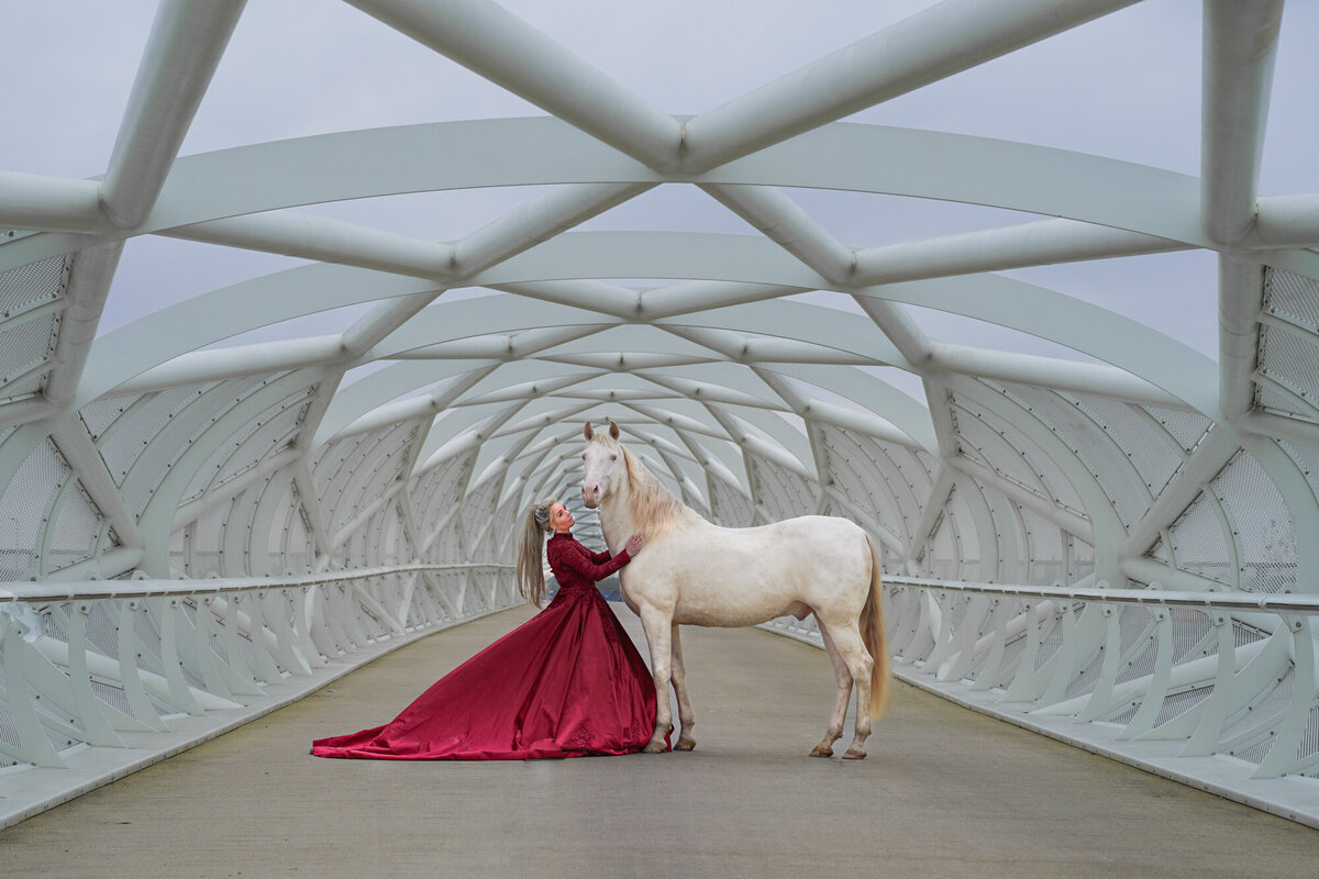 a-young-woman-in-a-beatifull-red-dress-on-a-bridge-2025-01-07-23-13-08-utc