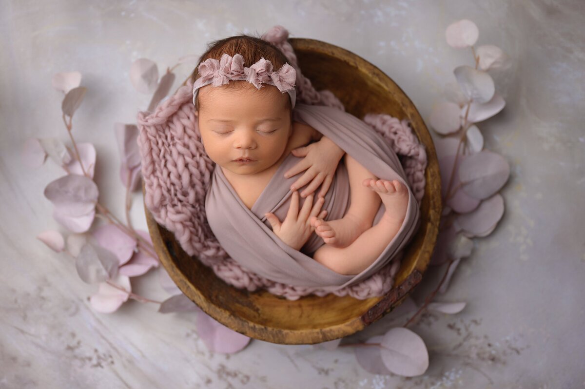 West Palm Beach studio newborn session with a purple floral theme.