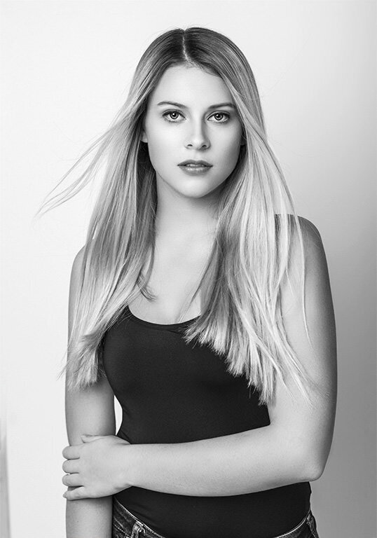 Black and white headshot of a model.
