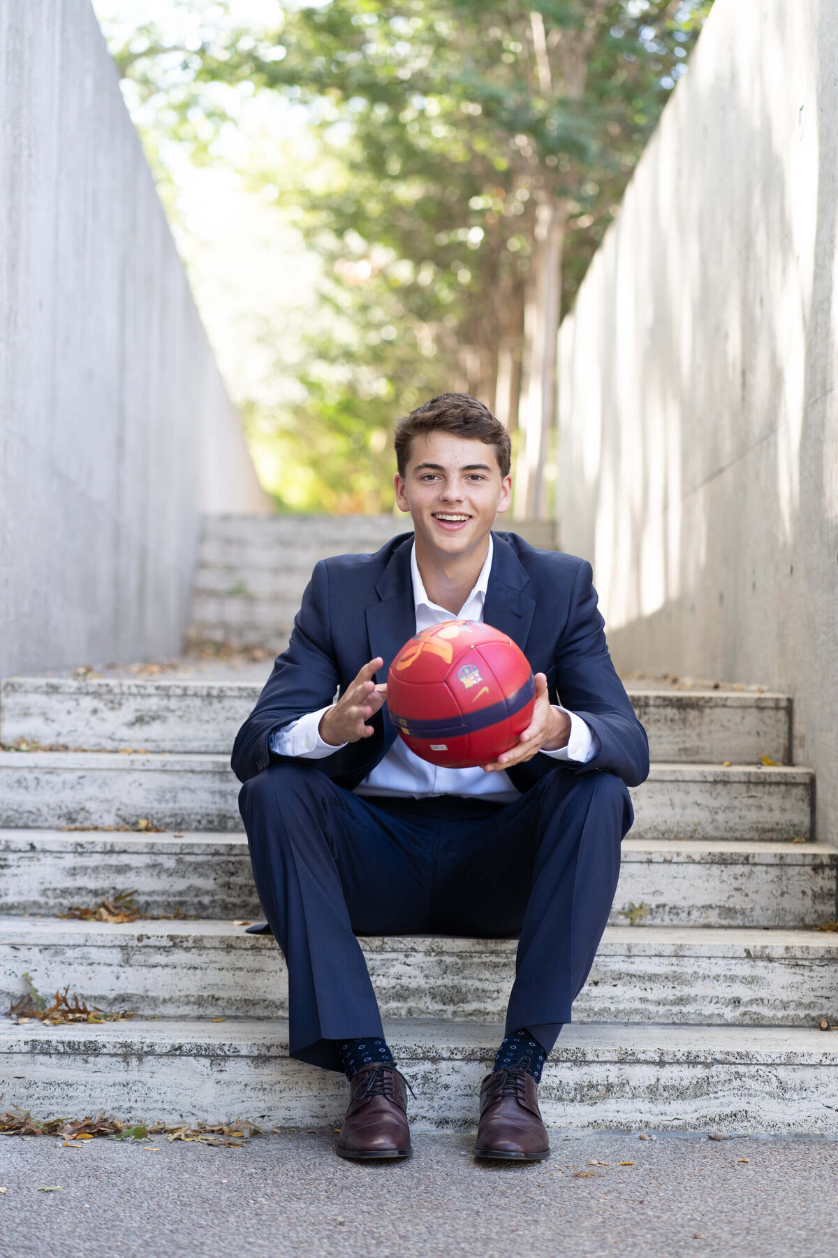 senior-guy-soccer-and-suit
