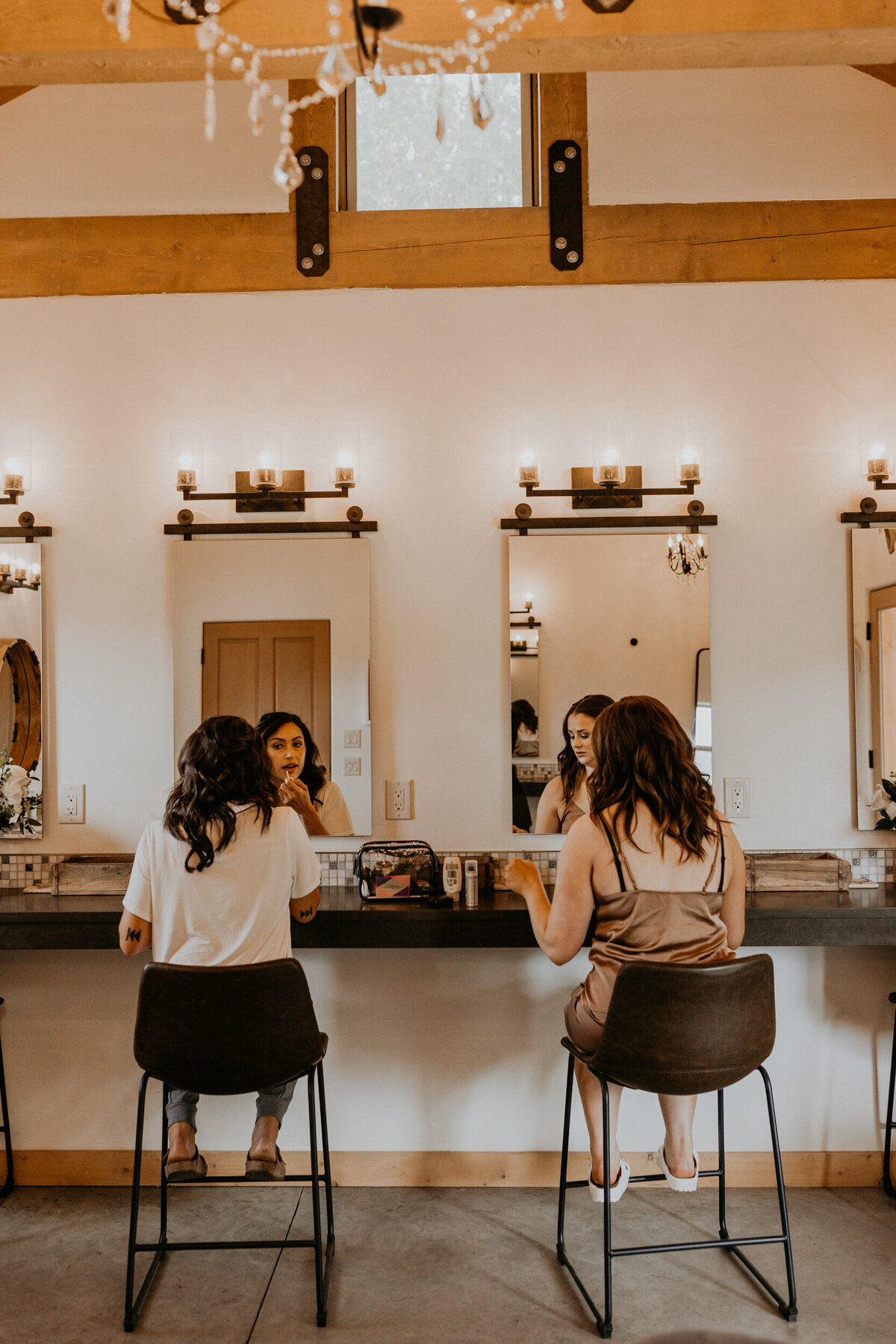 two brides getting ready for their wedding together