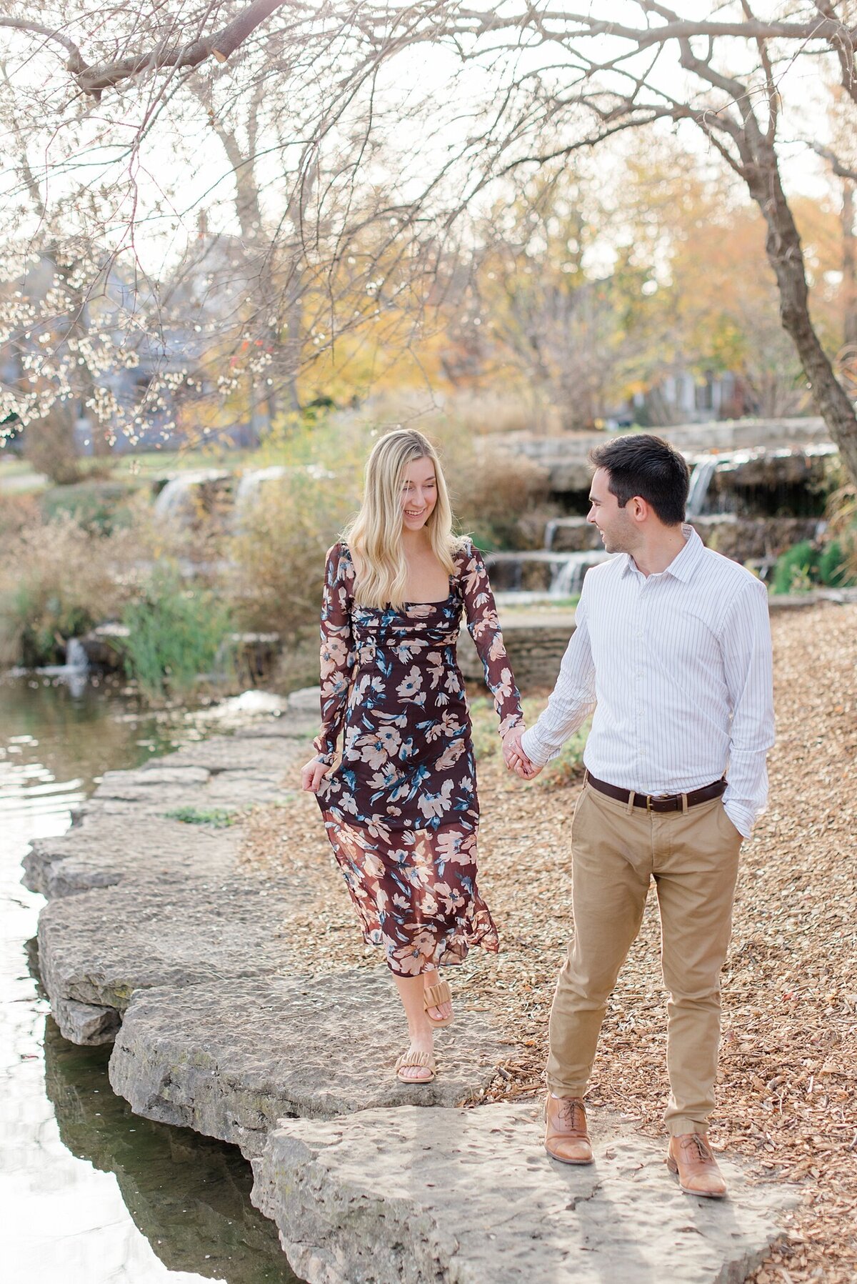 Couple walking during Franklin Park engagement session taken by Ohio Wedding Photographer