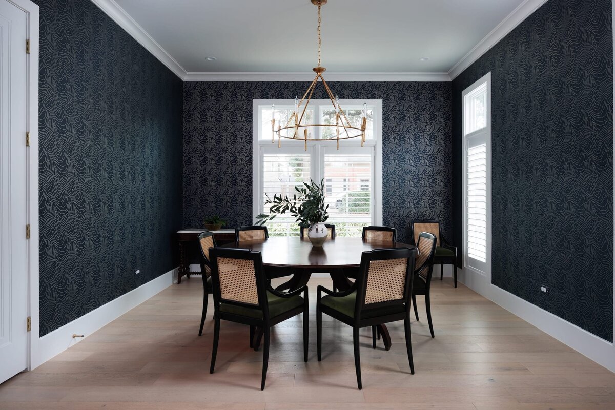 the keeping room interiors primera dining room with dark wallpaper and dark round table