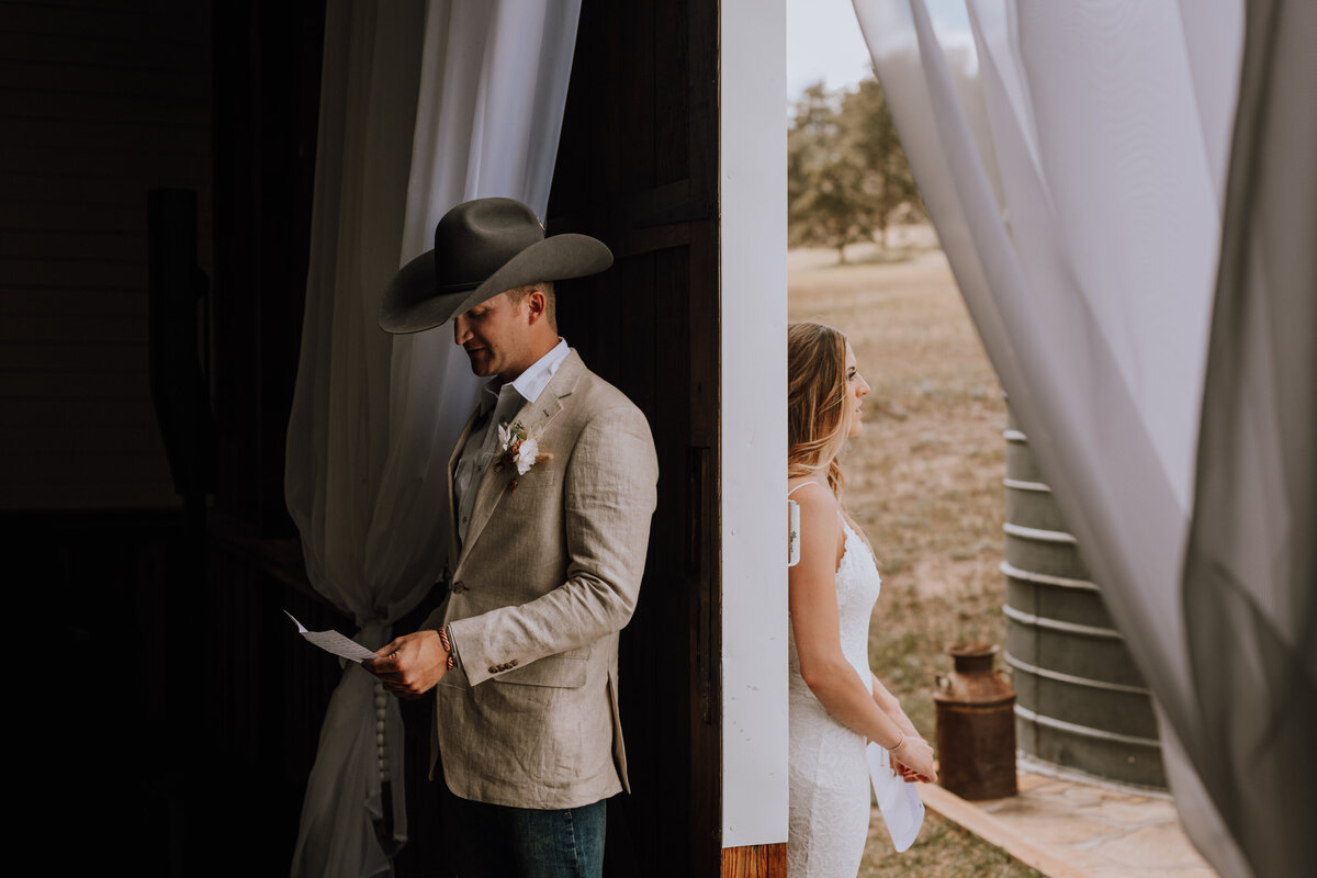 bride and groom reading vows  at younger ranch colorado