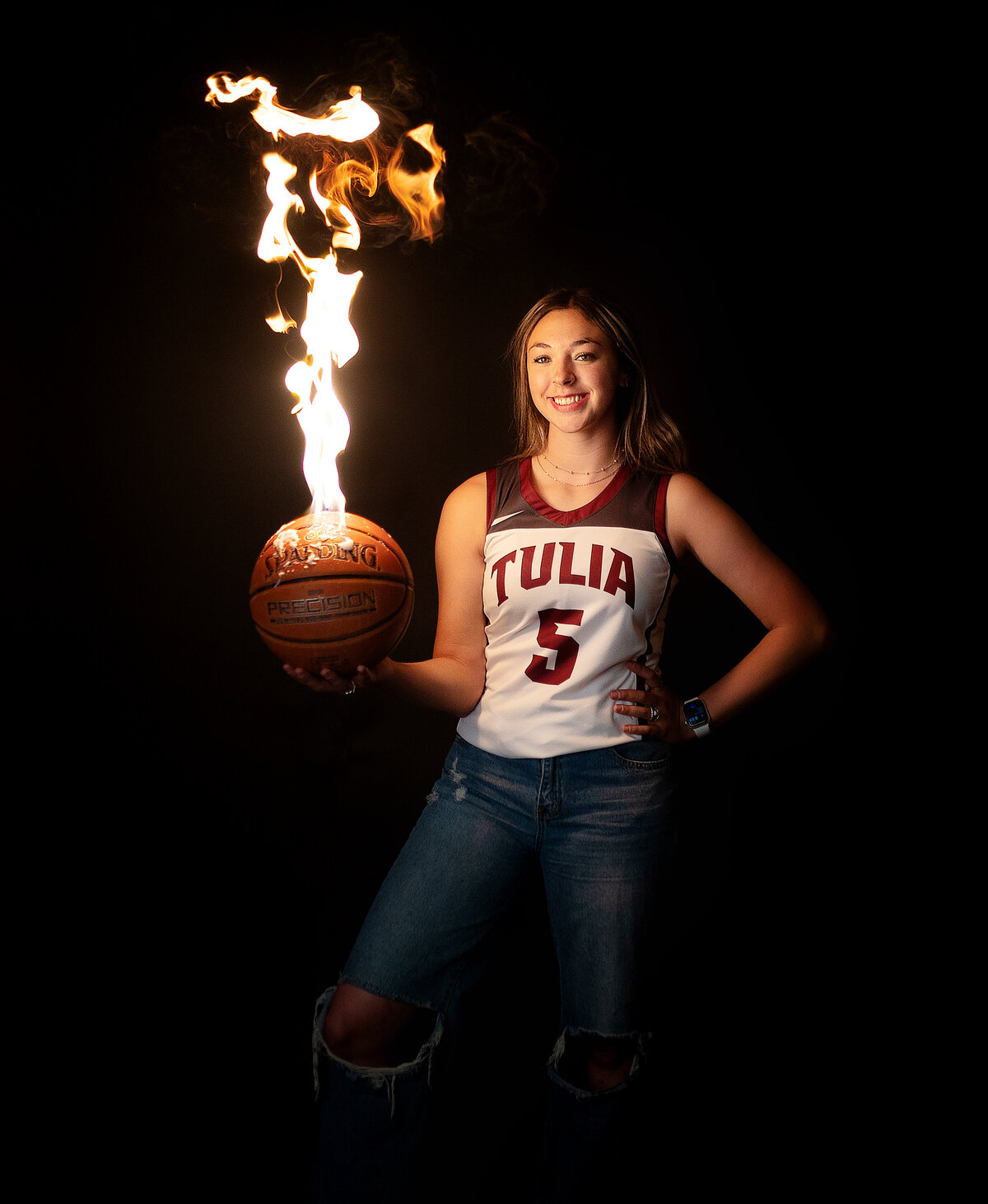 In studio session with high school varsity basketball player while the ball is on fire.