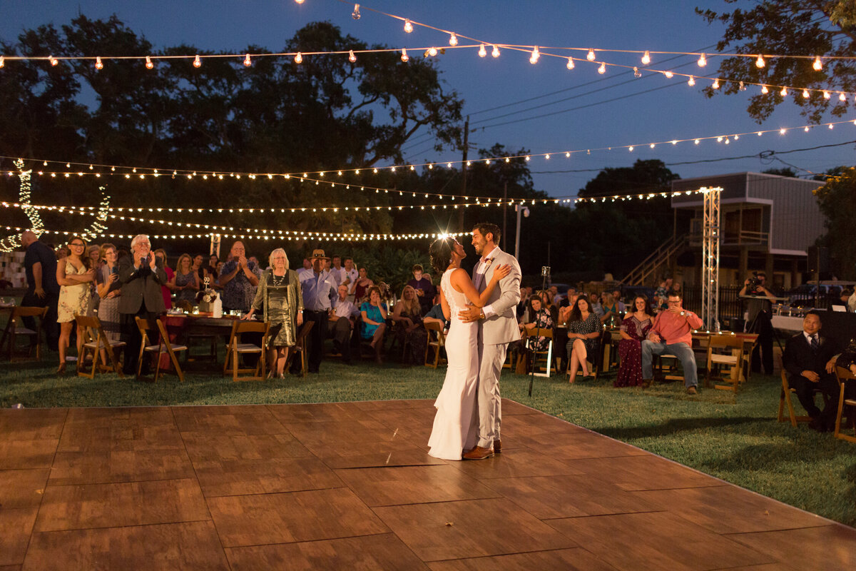 Wedding Photography, bride and groom dancing under twinkle lights