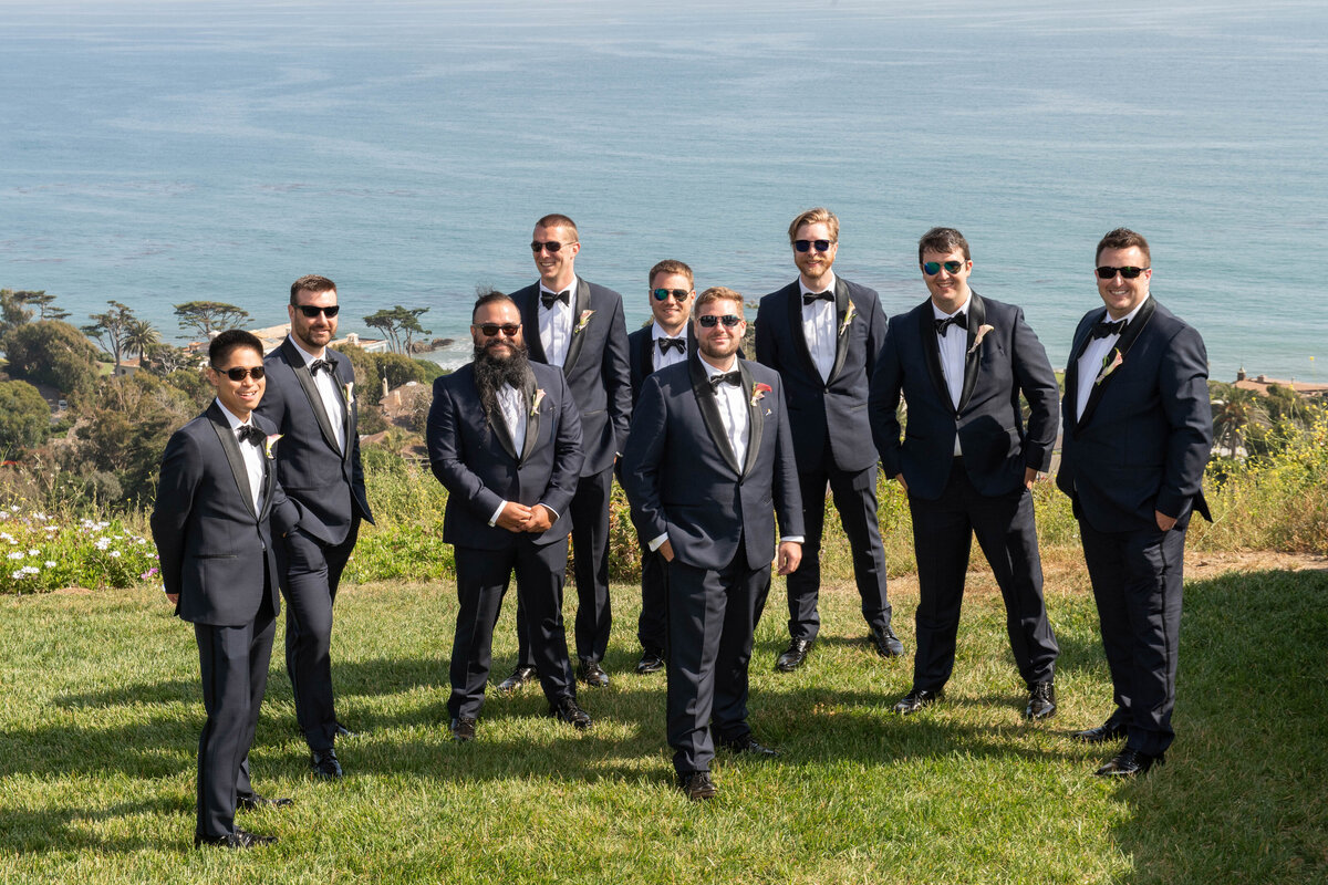 Groom with groomsmen wearing sunglasses