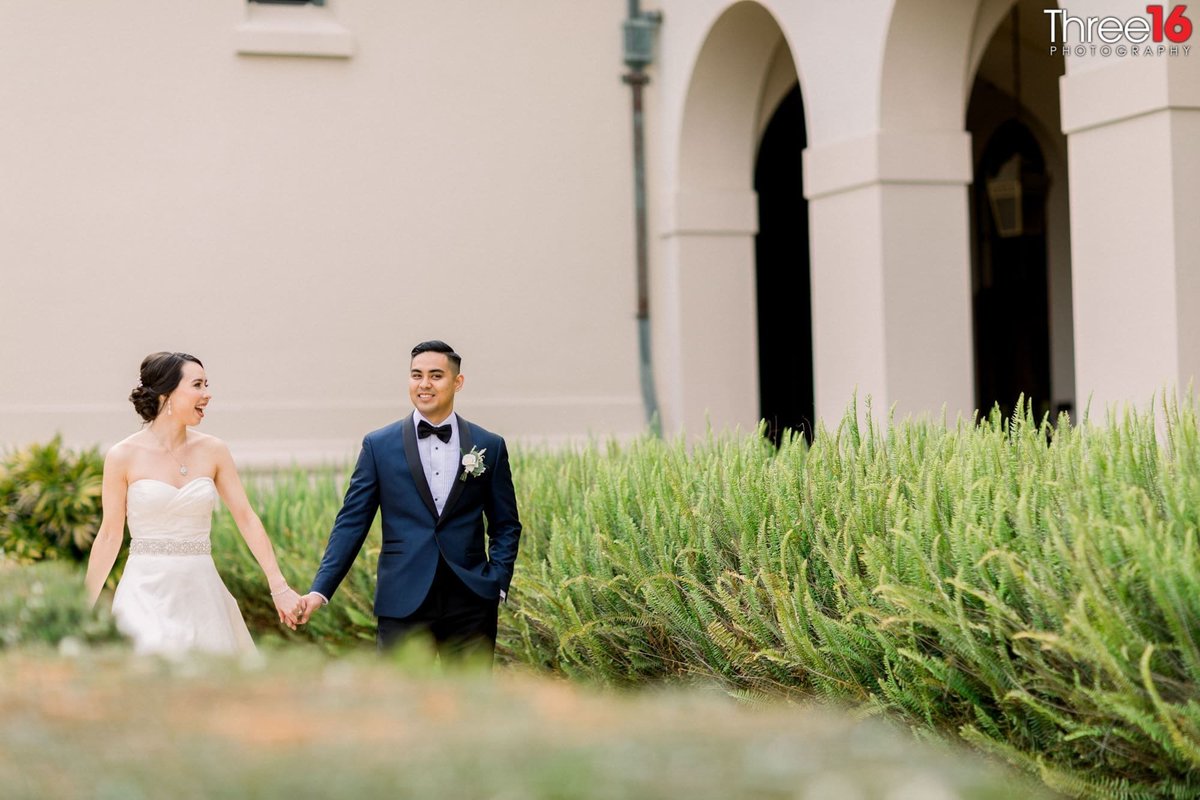 Bride and Groom walk hand in hand at the NOOR in Pasadena