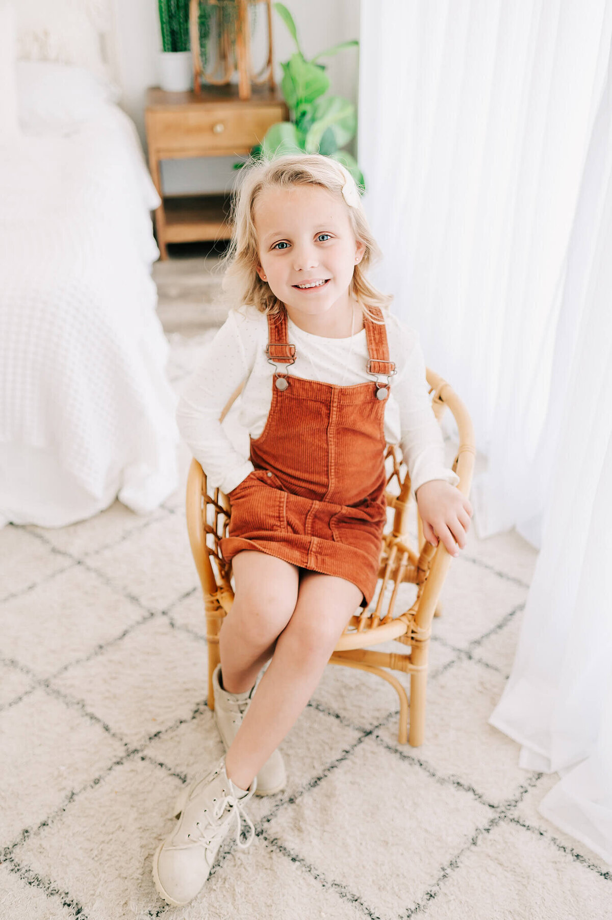 kids photo of little girl sitting in chair