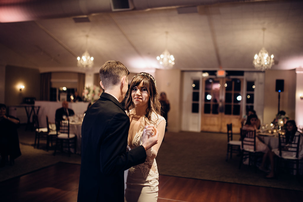 Wedding Photograph Of Bride In Dress And Groom In Black Suit Dancing Los Angeles