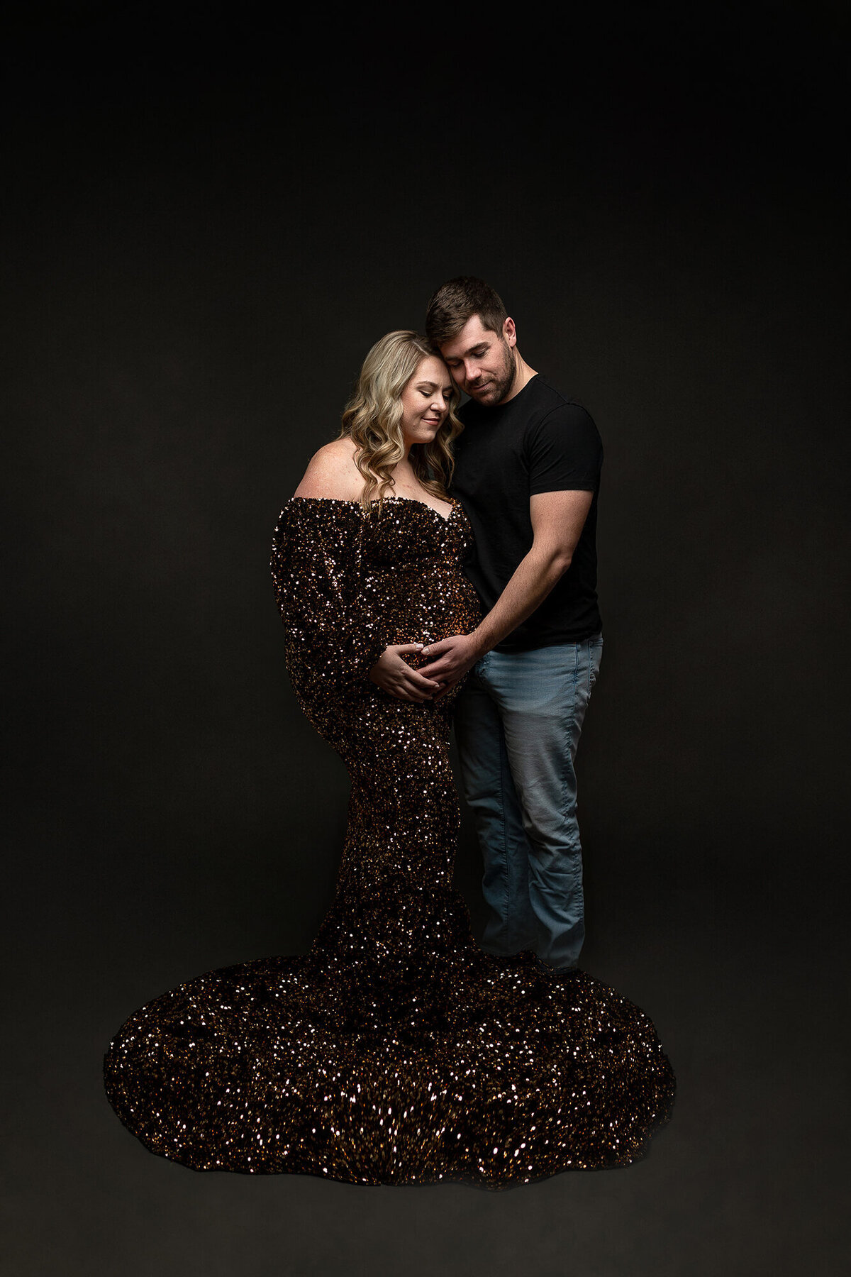 Beautiful couple posing together during their maternity session.