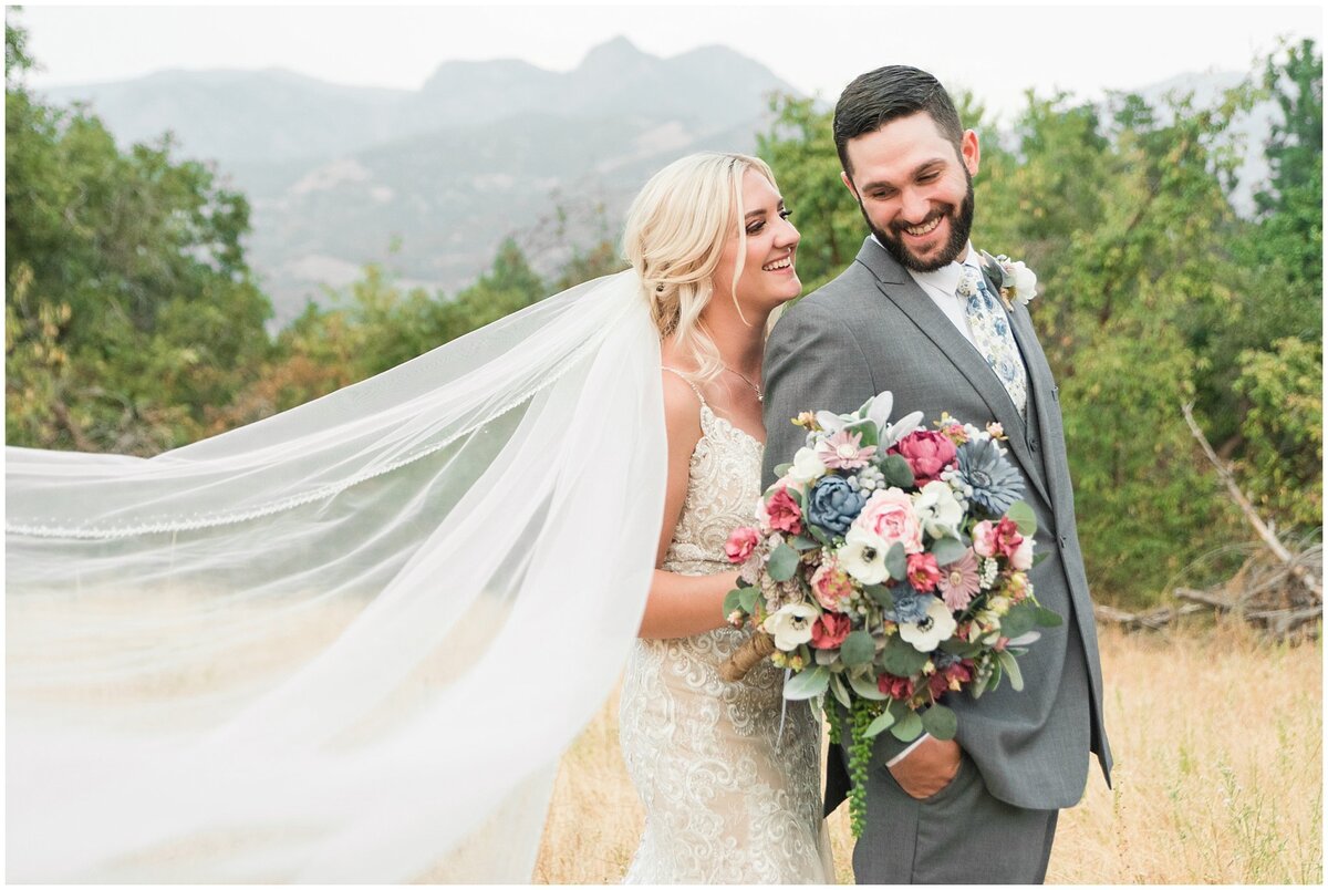 Bride and groom portraits with view of the mountains at Oak Hills Reception and Event Center