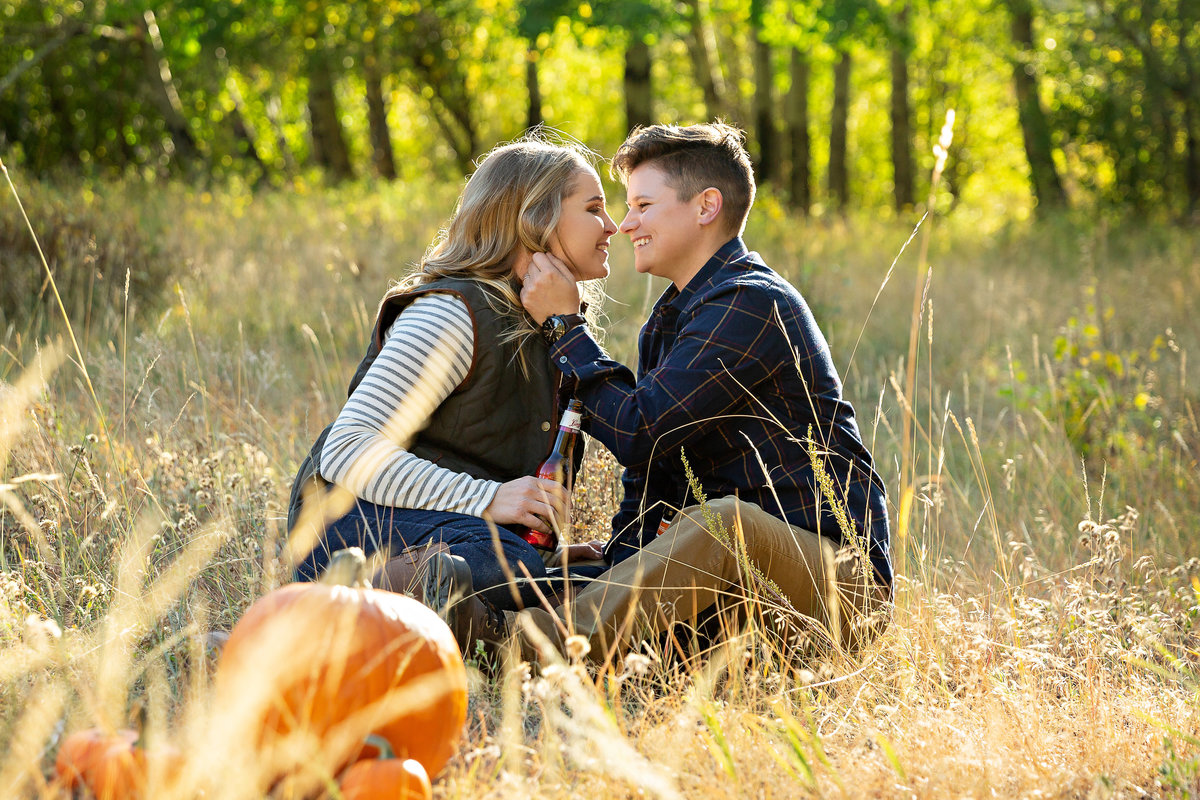 Fall harvest inspired engagement shoot of two women in love