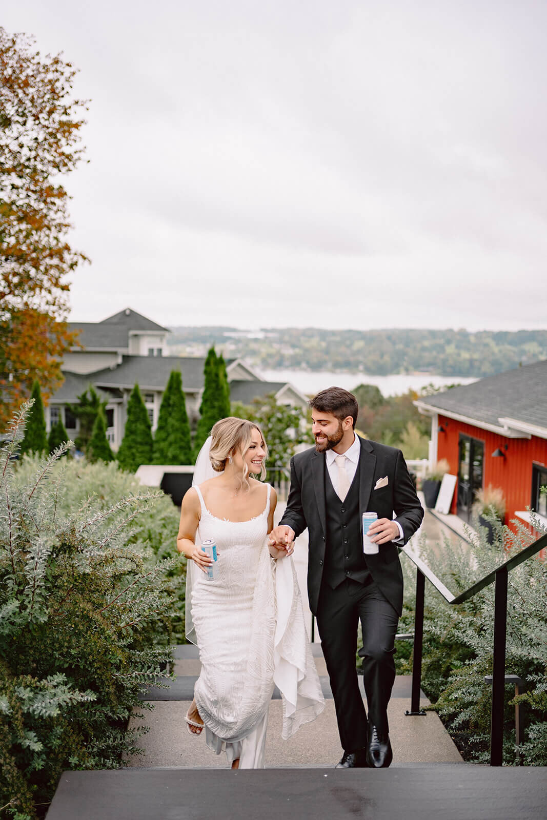 Bride and groom walking up steps