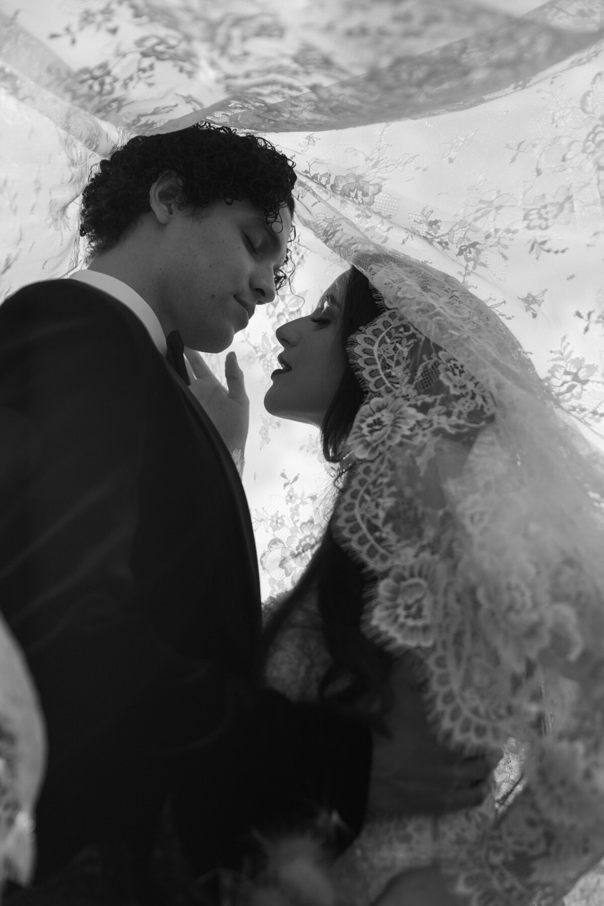 meredith-michel-editorial-wedding-under-veil-soft-focus