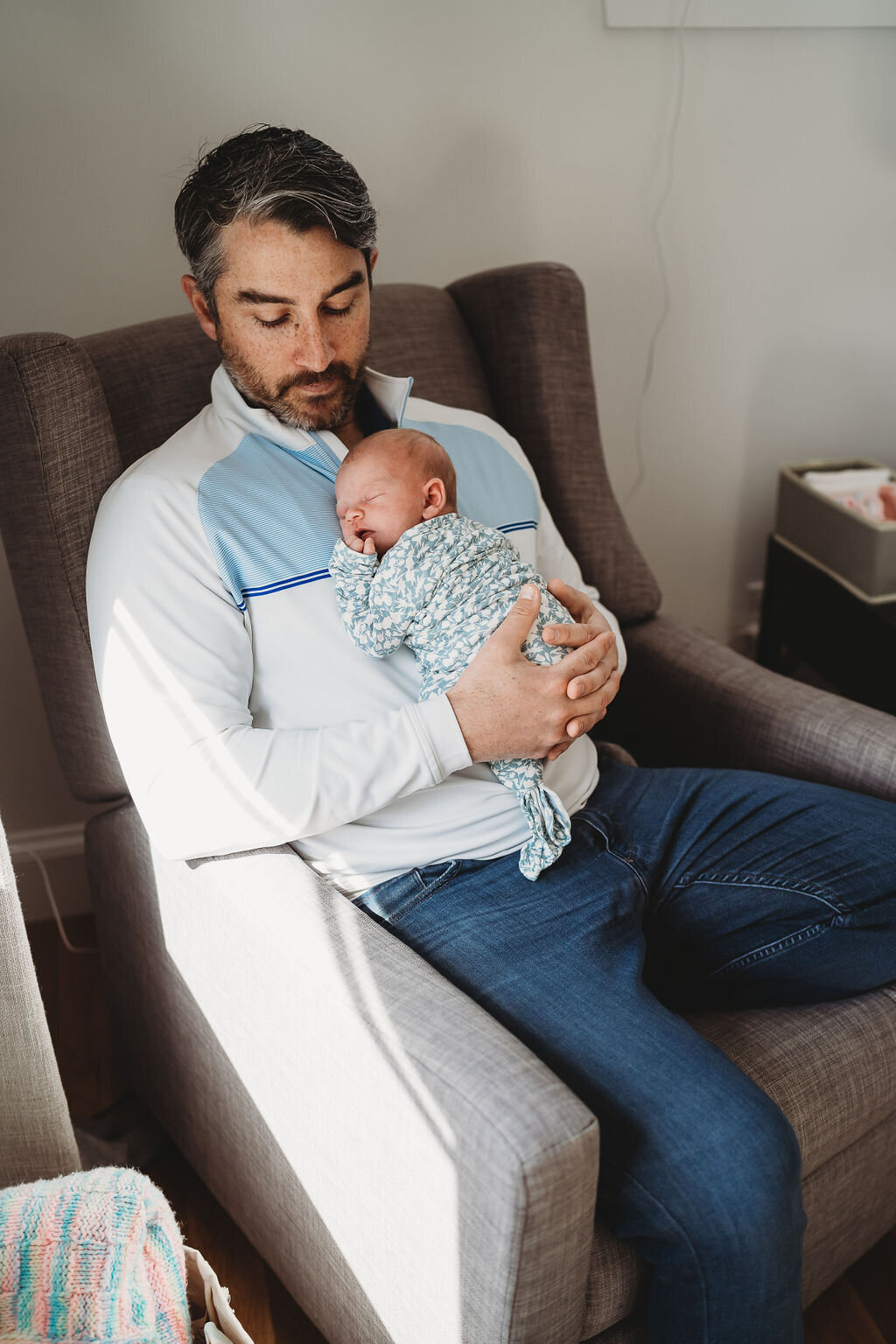 boston newborn photographer captures baby sleeping on dads chest