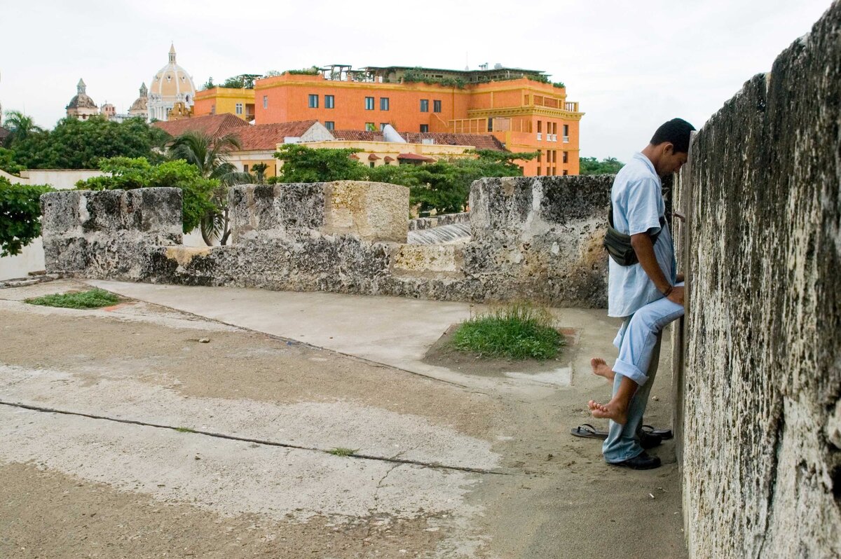 A couple sit on top of a castle facing each other