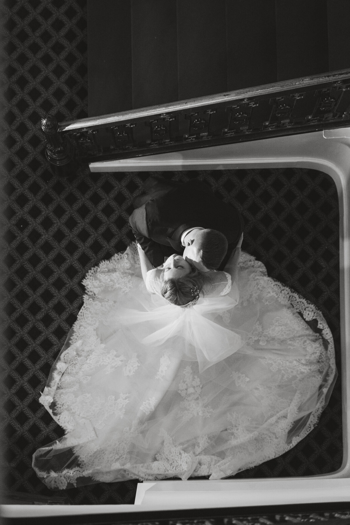 aerial shot of bride and groom from the top of the staircase in black and white from wedding at The Carltun