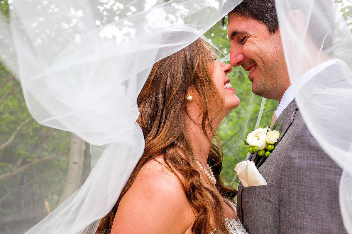 close up embrace between bride and groom