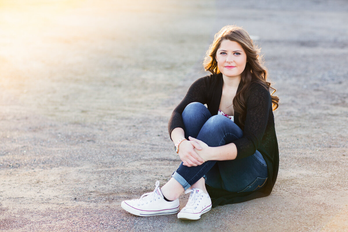 high school senior girl poses for senior photography session