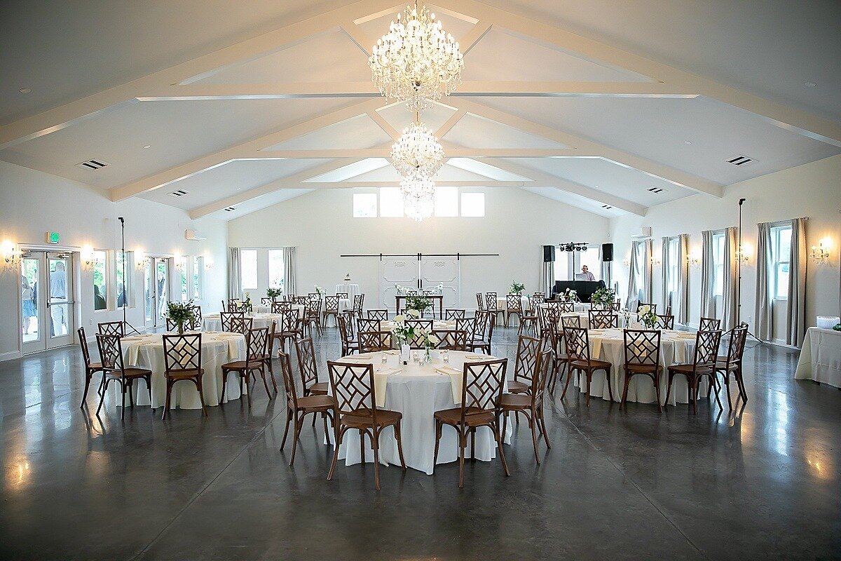 Reception-Banquet-Chairs-Crystal-Chandeliers-White-Barn-Style Venue-The-Legacy-at-Willow-Pond-Wedding-Virginia.JPG