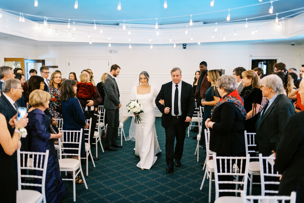 Dad walking the bride at the ceremony at the ST. Paul College Club