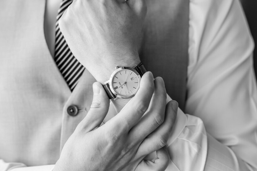 groom-adjusting-watch