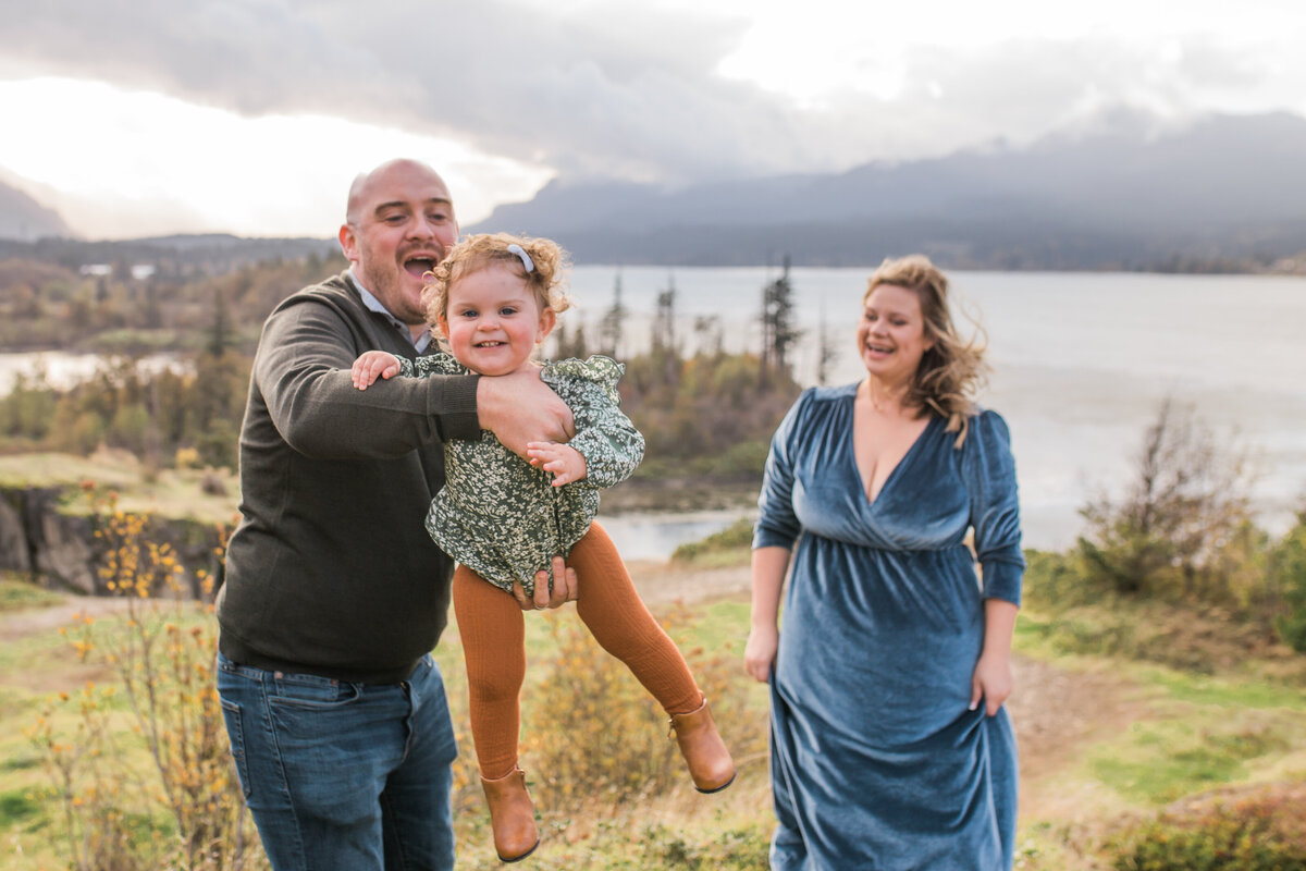 Dad swings daughter in family photography session near Portland Area