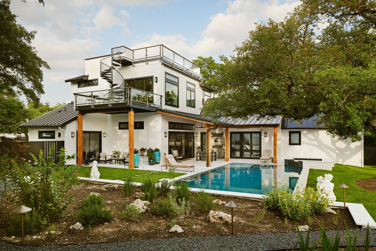 custom in-ground pool in austin, texas luxury home. spiral staircase and rooftop balcony on custom home