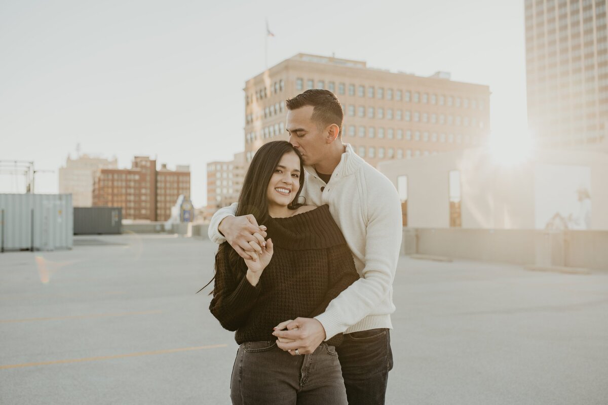 couple kissing on rooftop in amarillo texas downtown, , Emily wheeler photography