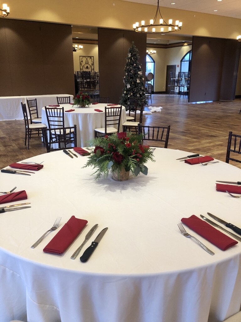 small centerpiece, red flowers, red accents, white linens