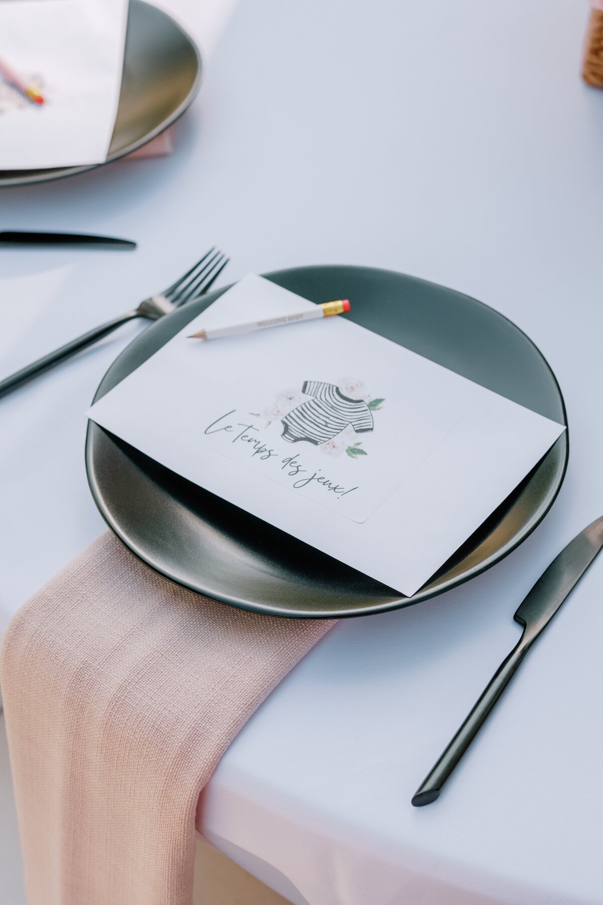 black and white flatware with pink accents