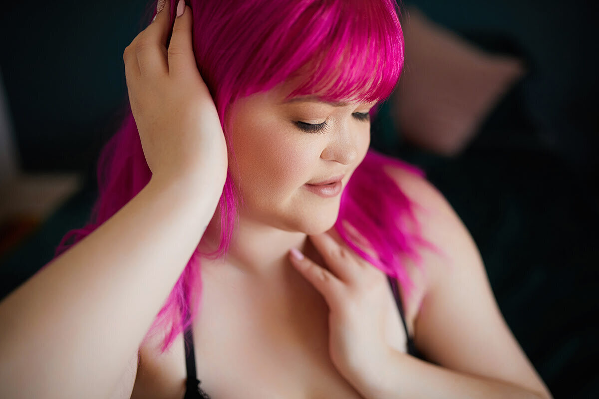 Woman with pink hair posing