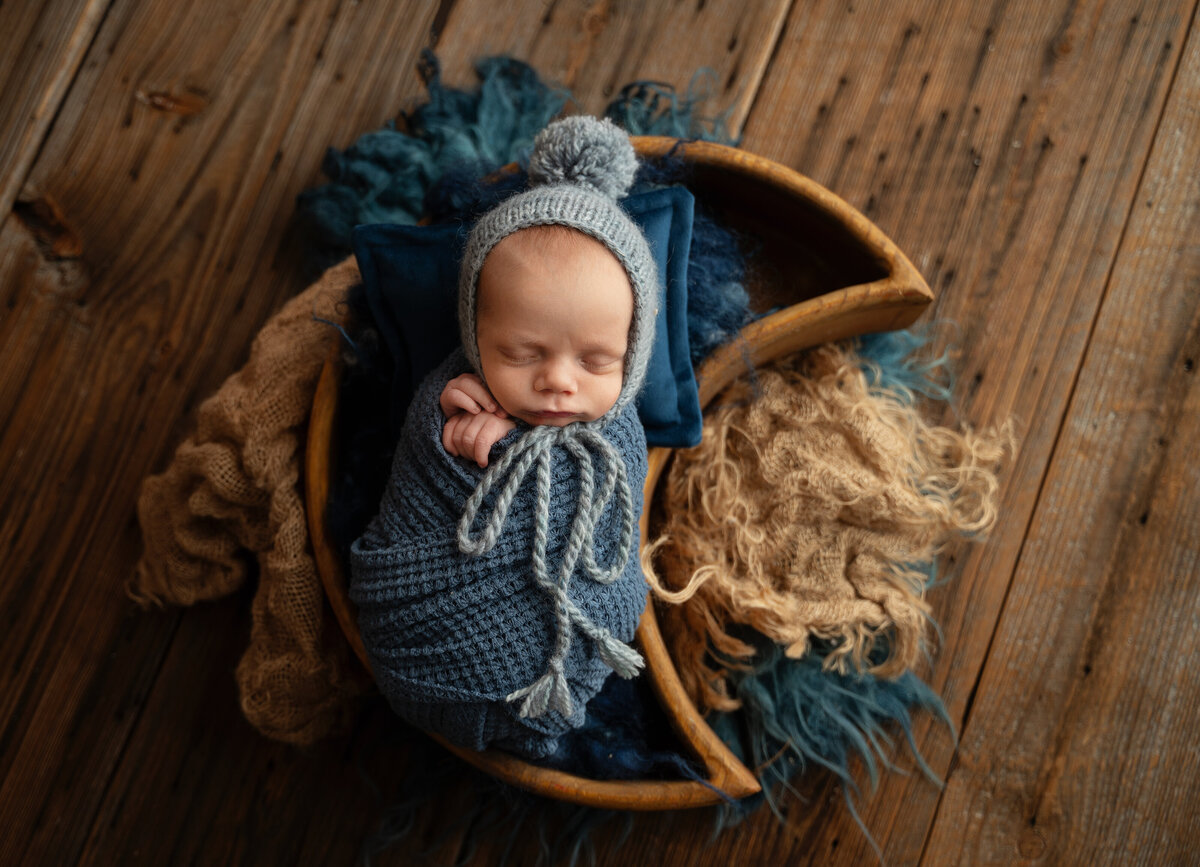 colleyville baby boy swaddled in moon prop