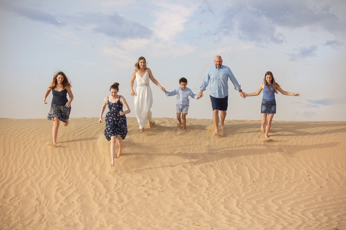 family-running-in-the-desert