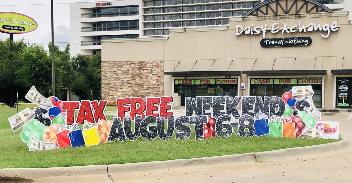 Tax Free Weekend Sign Setup for Daisy Exchange. Simply Sign It is a yard greeting sign rental company servicing Edmond, NW OKC, Piedmont, and Deer Creek.
