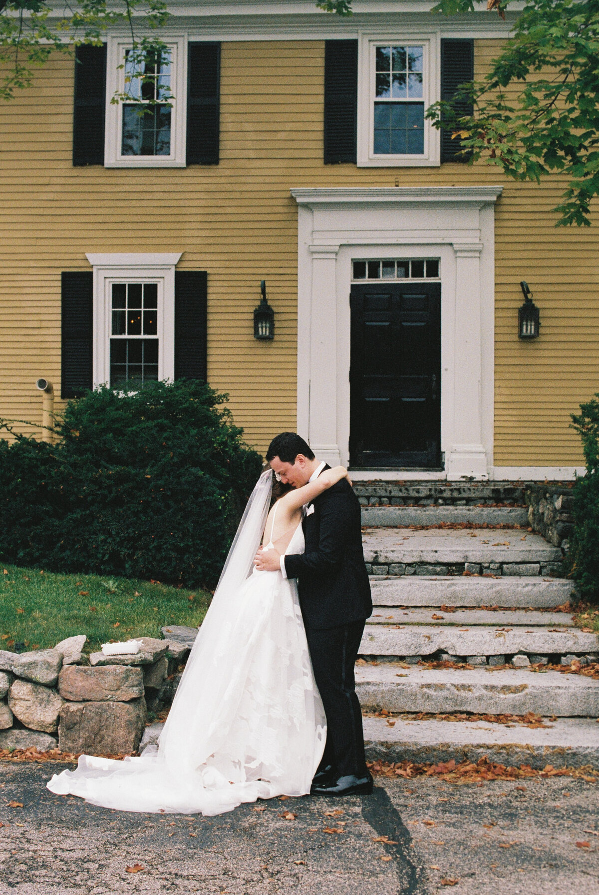 bride and groom hugging
