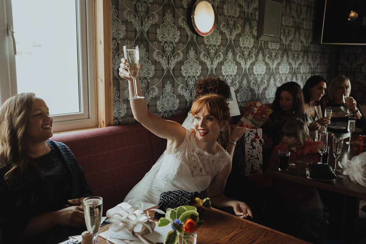 bride holding up her glass